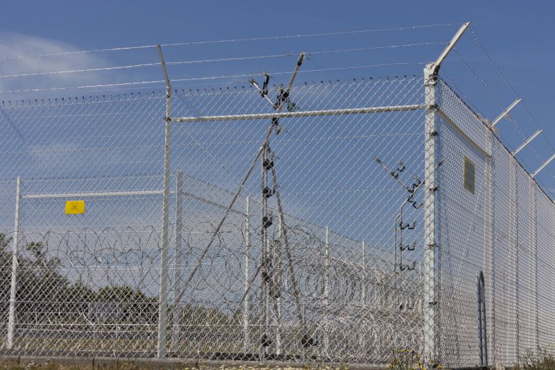Chain-Link Fence with Barbed Wire